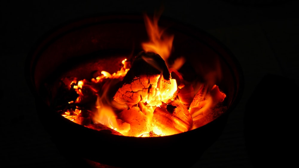 Burning wood and orange coals in a fire