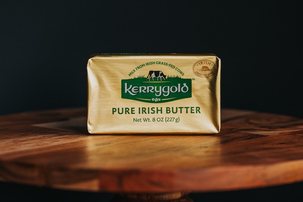 a bar of butter sitting on top of a wooden table