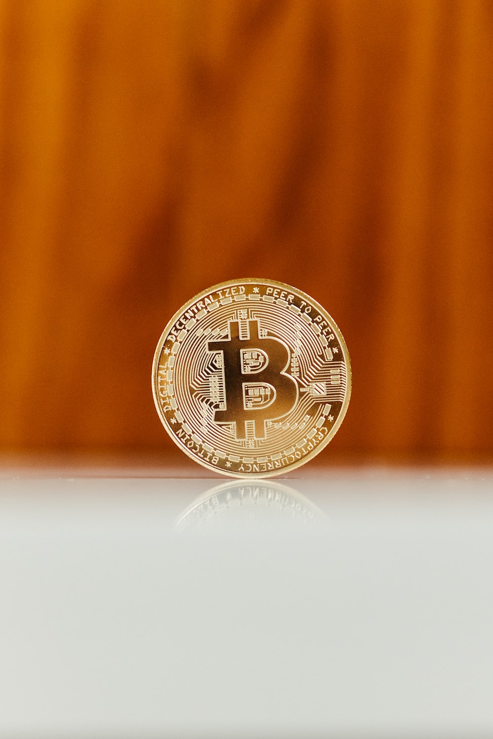 a bit coin sitting on top of a table