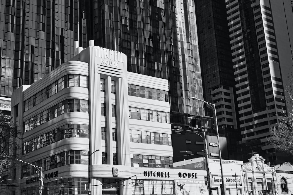 a black and white photo of a building in a city