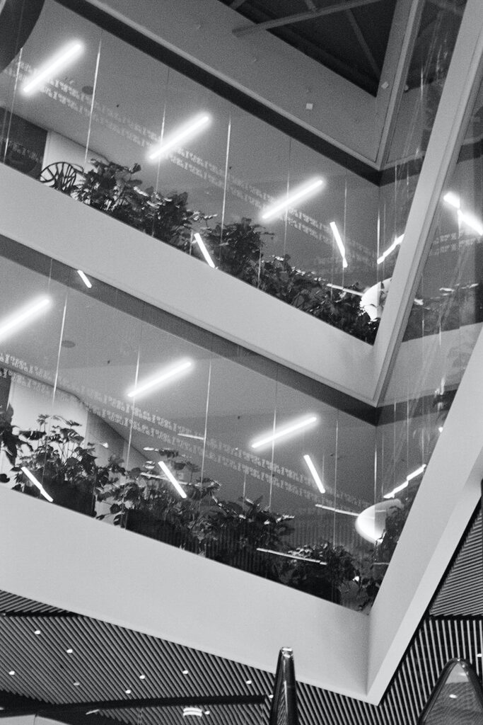 a black and white photo of a building's atrium