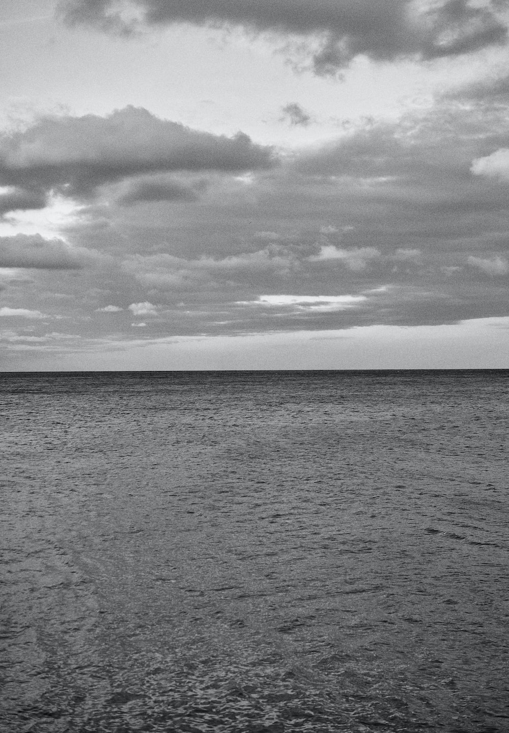 a black and white photo of the ocean