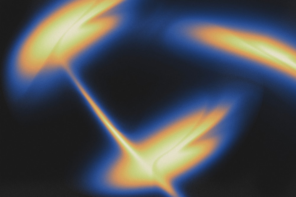 a blurry image of a yellow and blue object