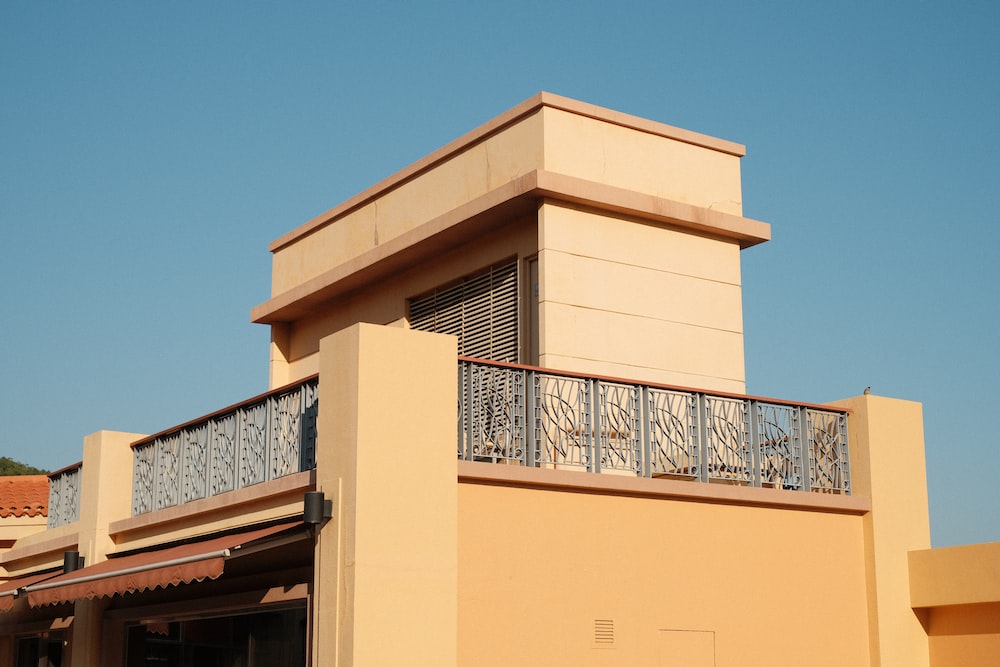 a building with a balcony and a balcony railing