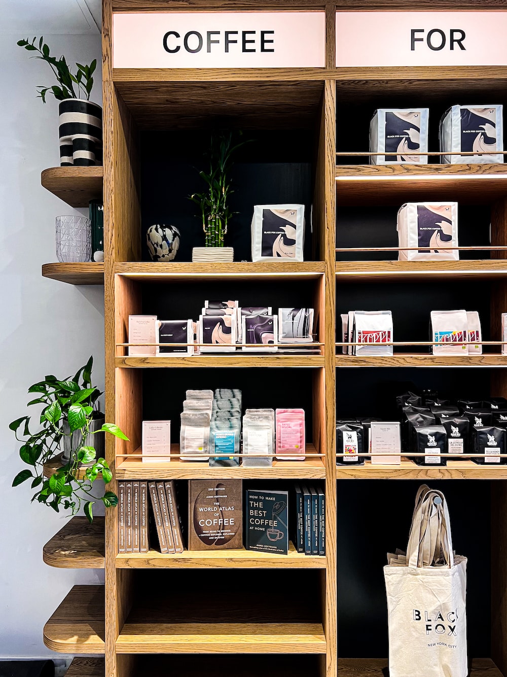 a coffee shop with shelves of coffee and books