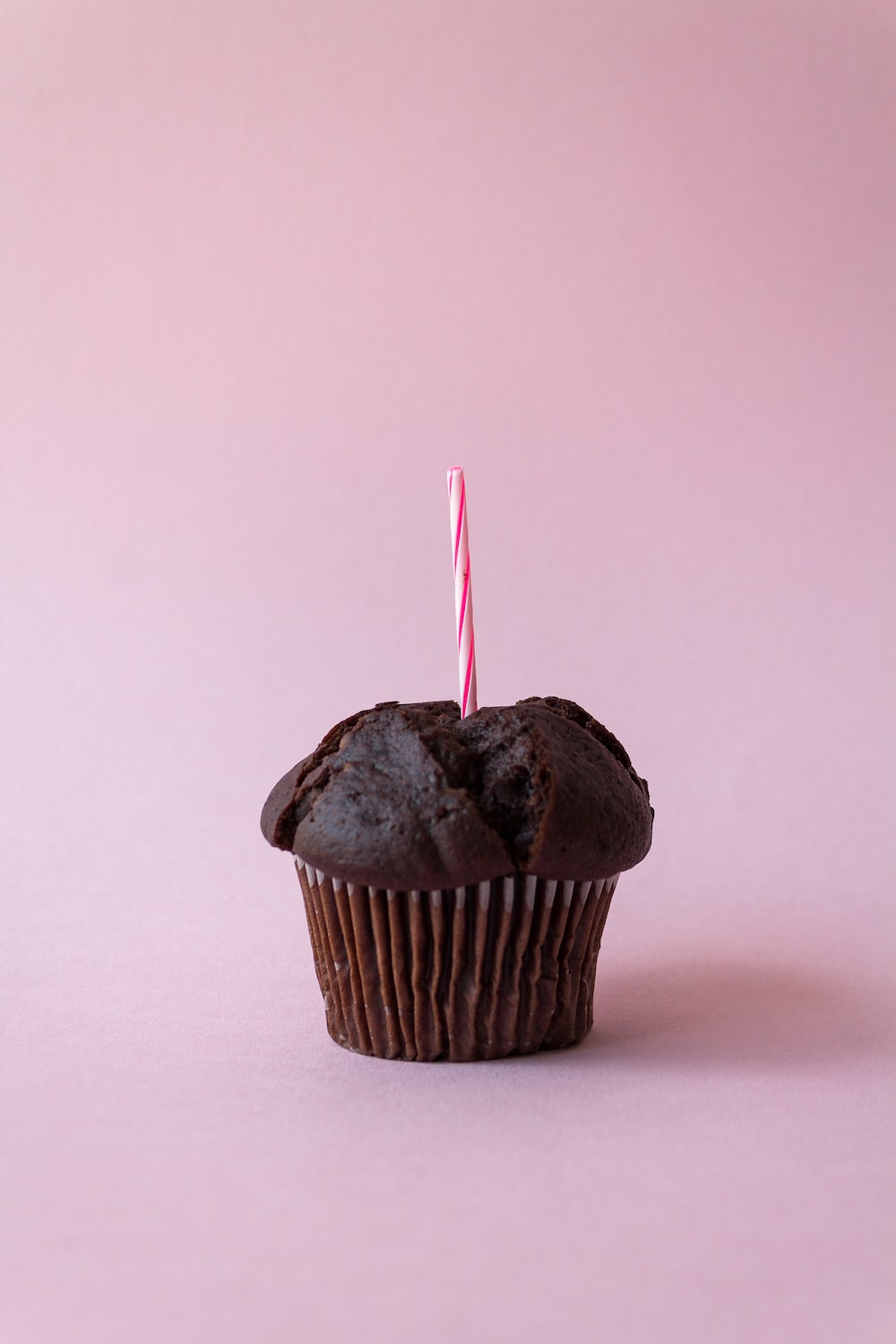 a cupcake with a straw