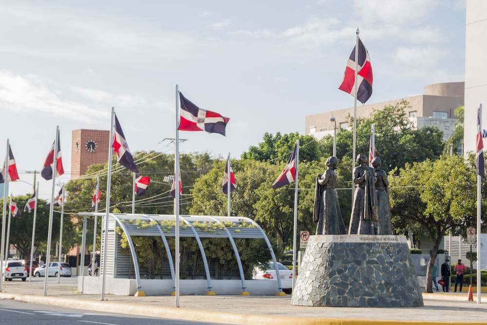 a fountain with flags and statues
