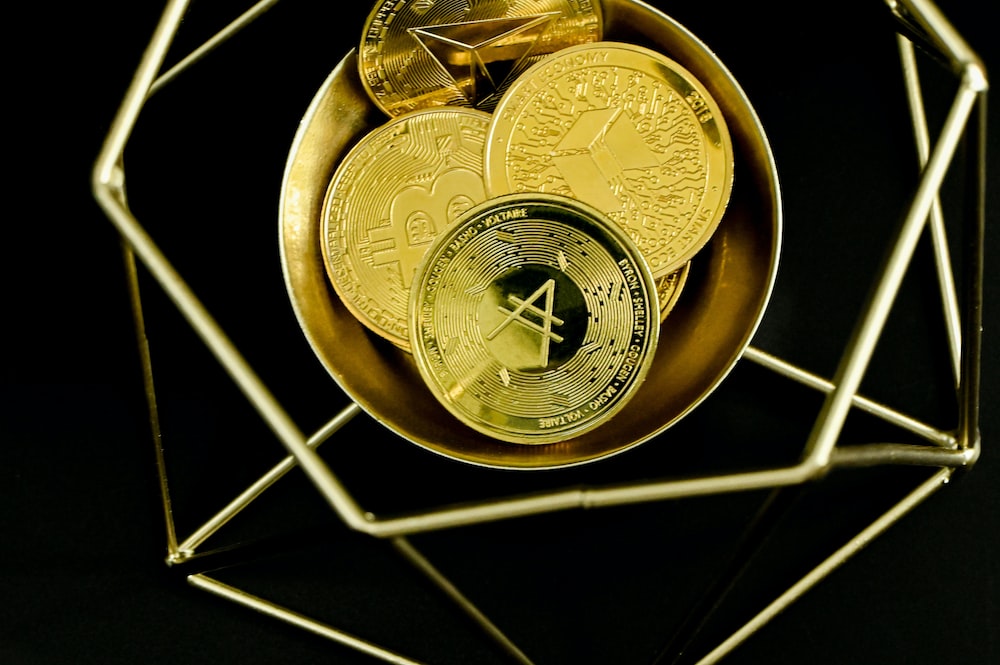 a gold plate with some gold coins in it