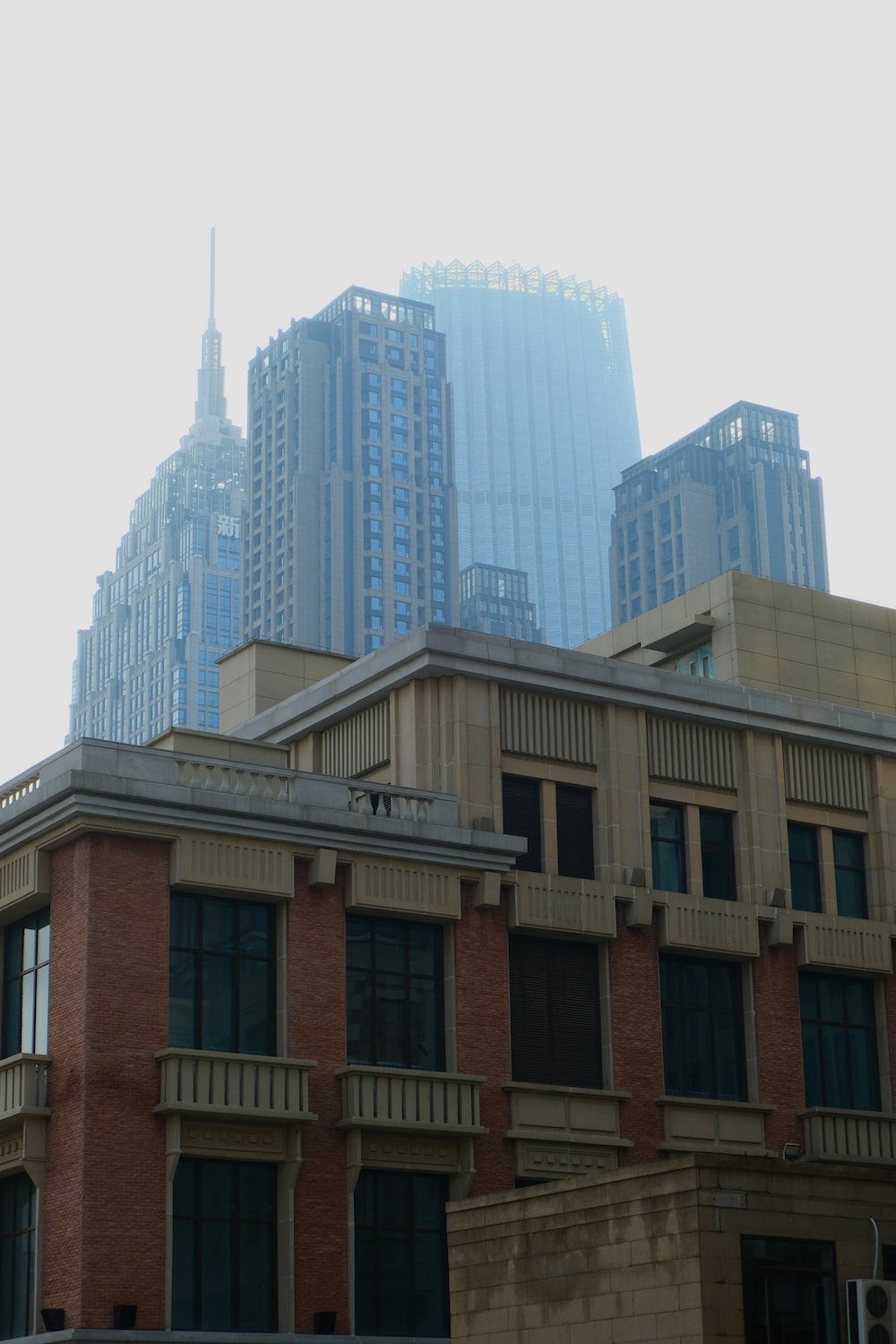 a group of buildings with a cloudy sky