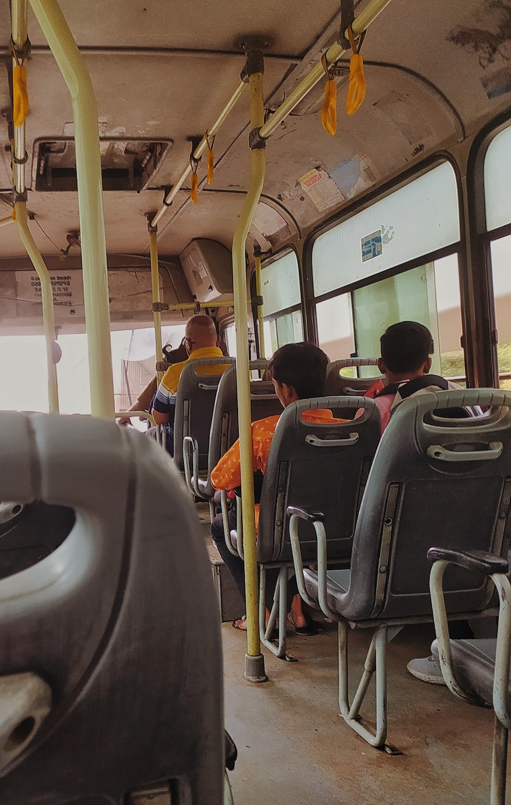 a group of people ride on a bus