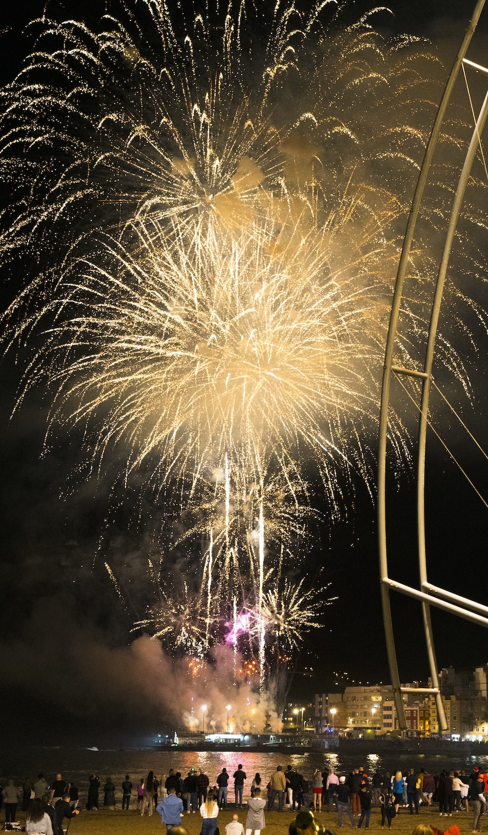 a group of people standing around a firework display