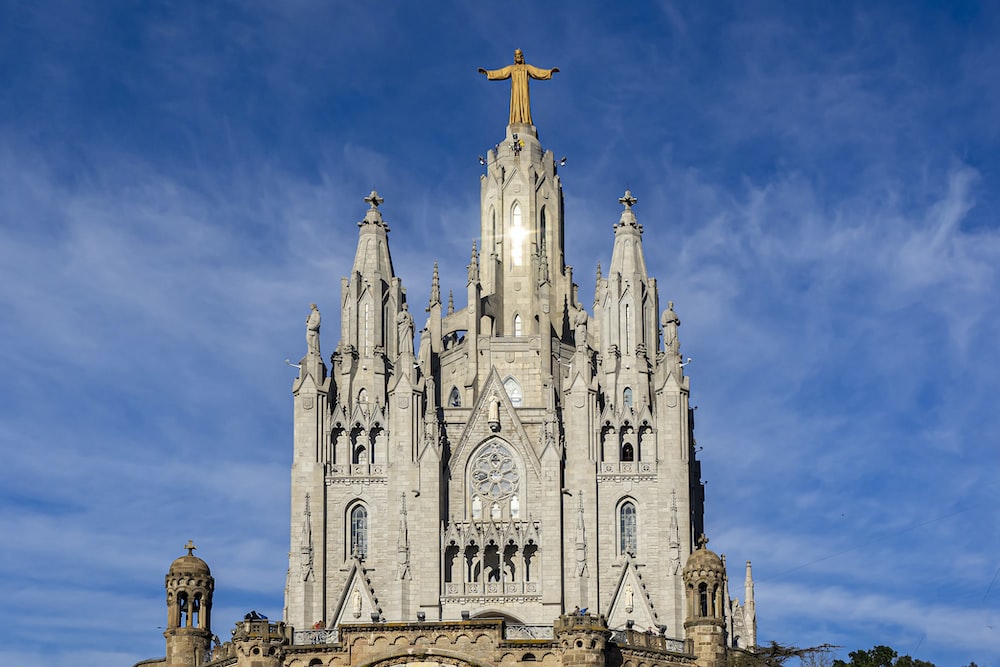 a large cathedral with a cross on top of it