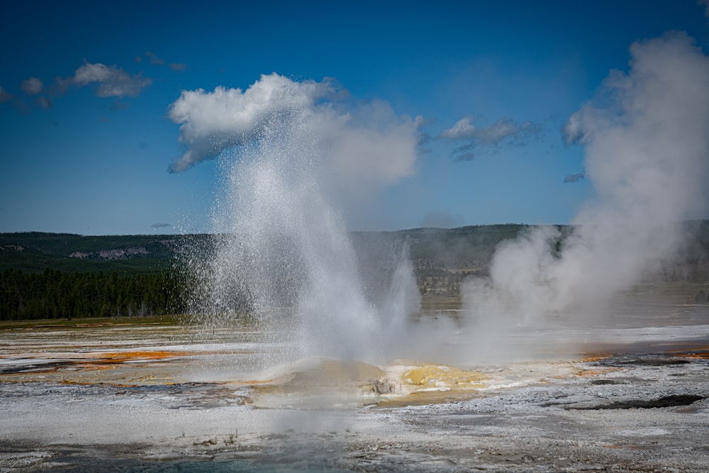 a large geyser in a field
