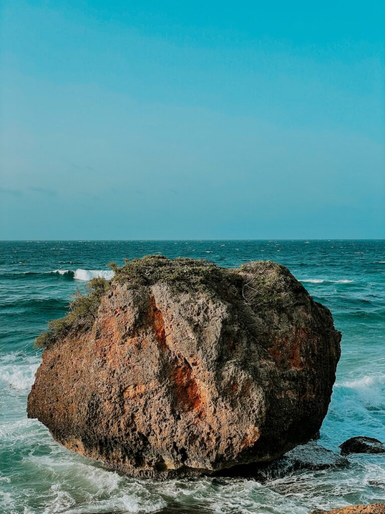 a large rock in the ocean