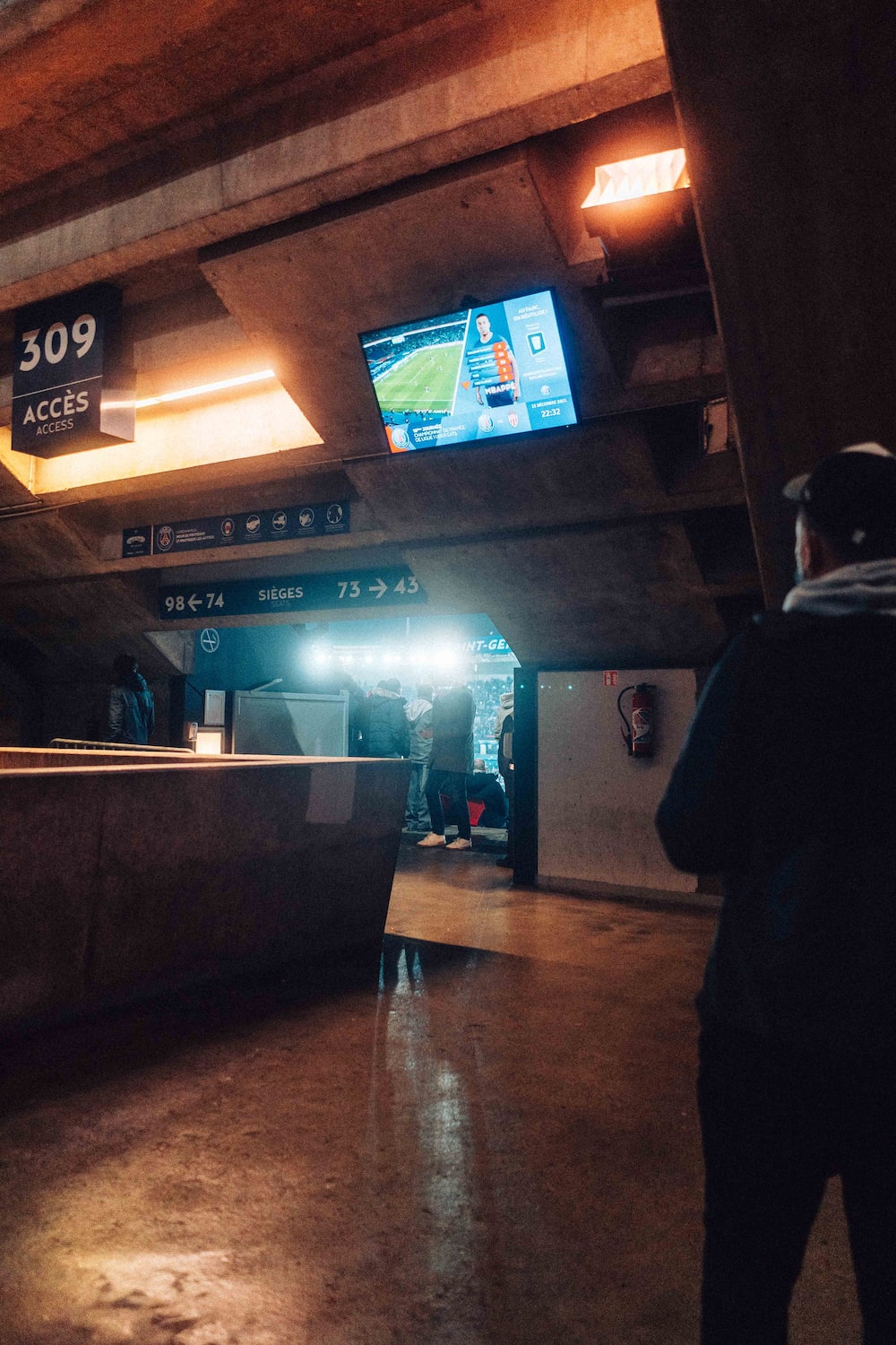 a man is standing in a subway station