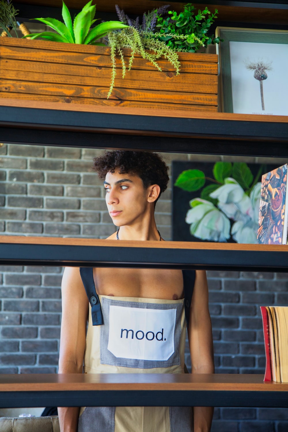 a mannequin wearing an apron with the word mood printed on it
