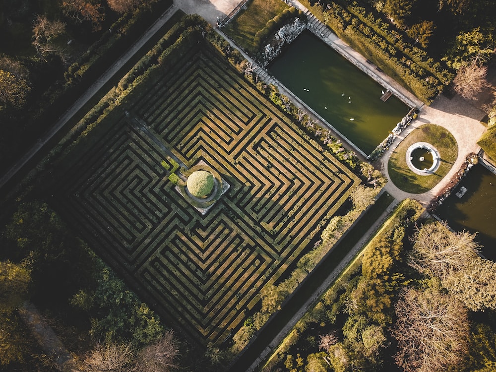 an aerial view of a maze in a park