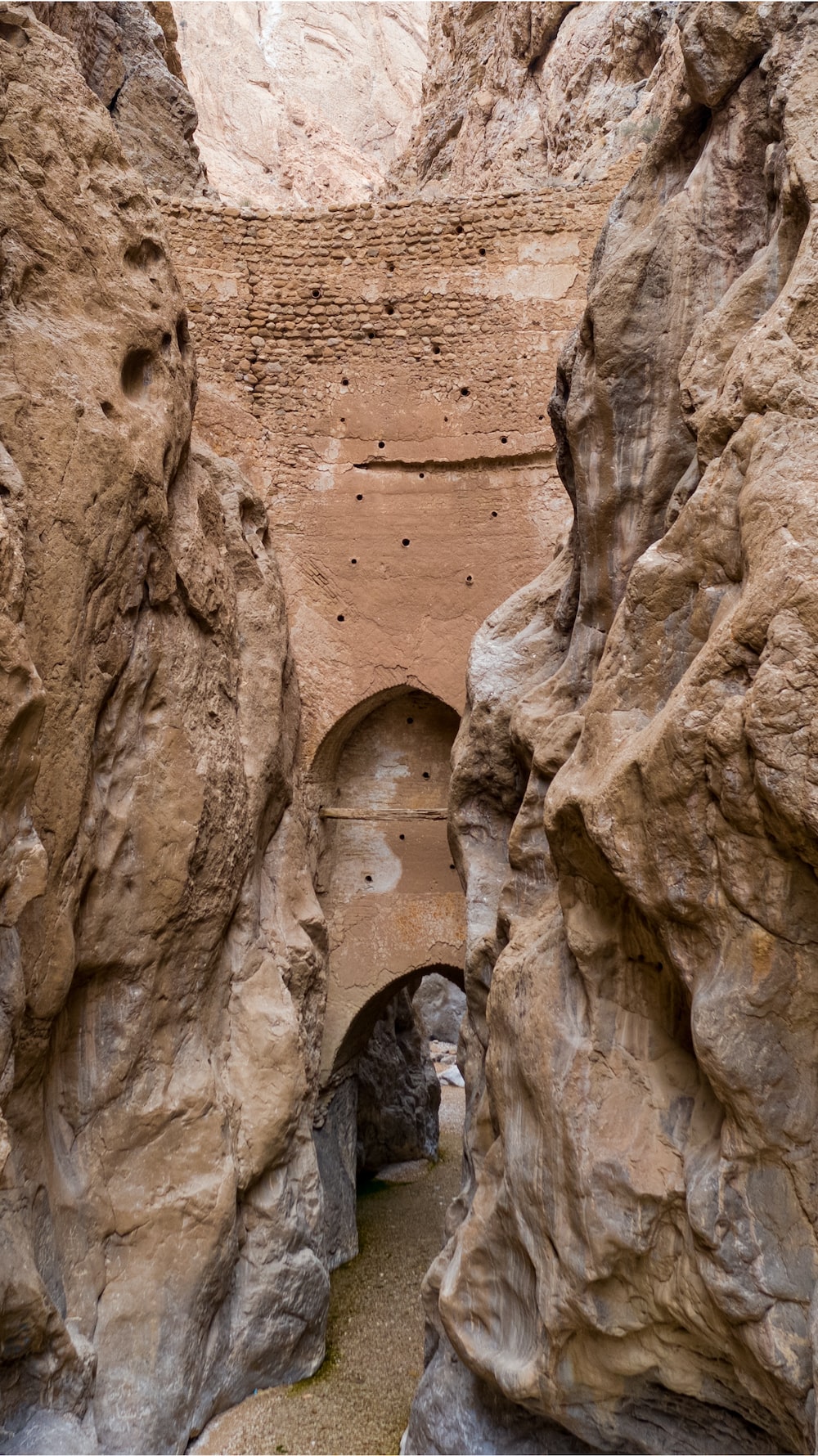 a narrow tunnel between two large rocks