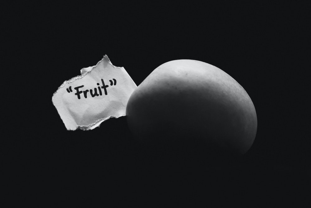 an egg and a piece of paper with the word truth written on it