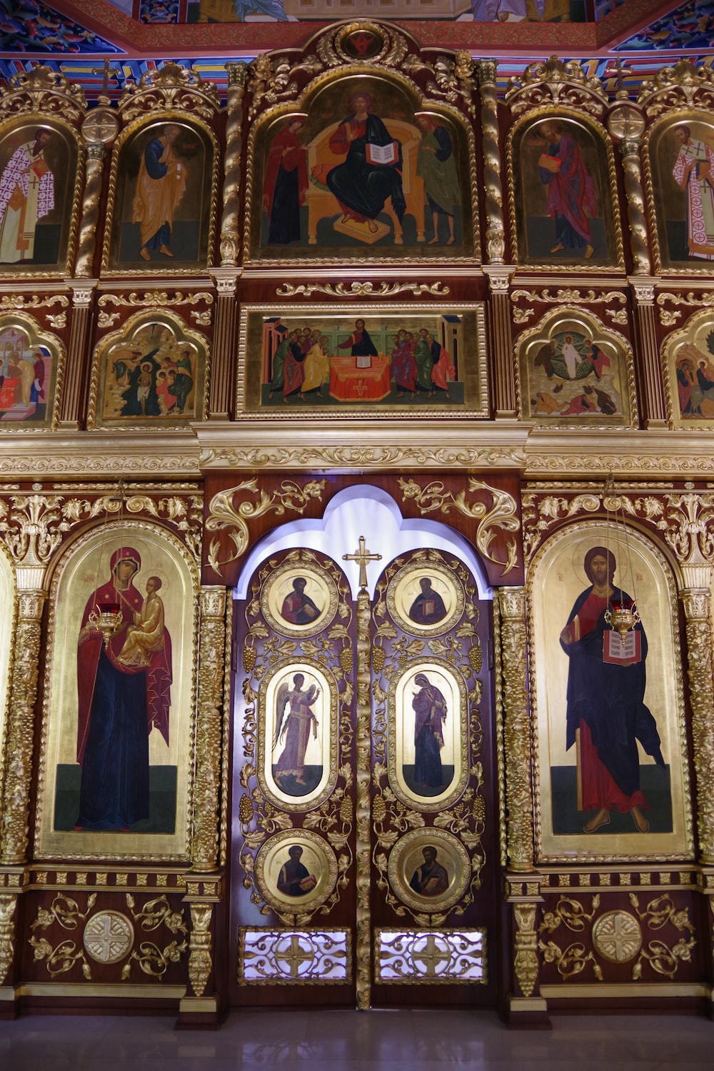 an ornately decorated church with paintings on the walls