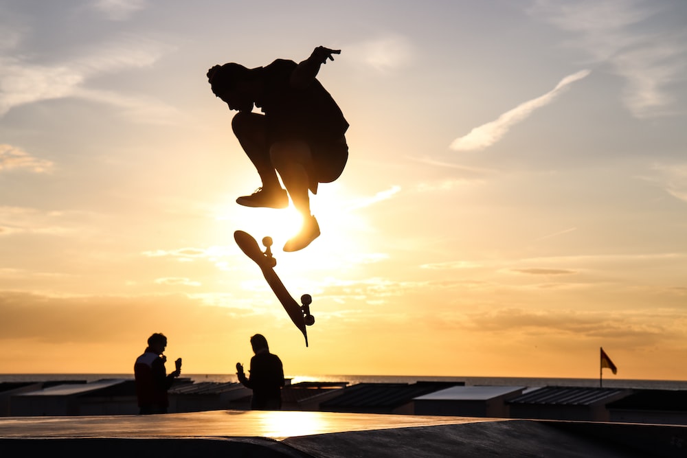 a person jumping with a skateboard