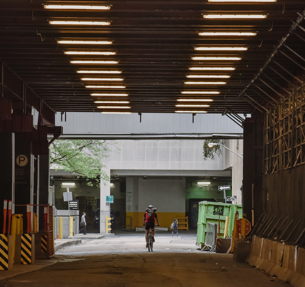 a person riding a bike in a warehouse