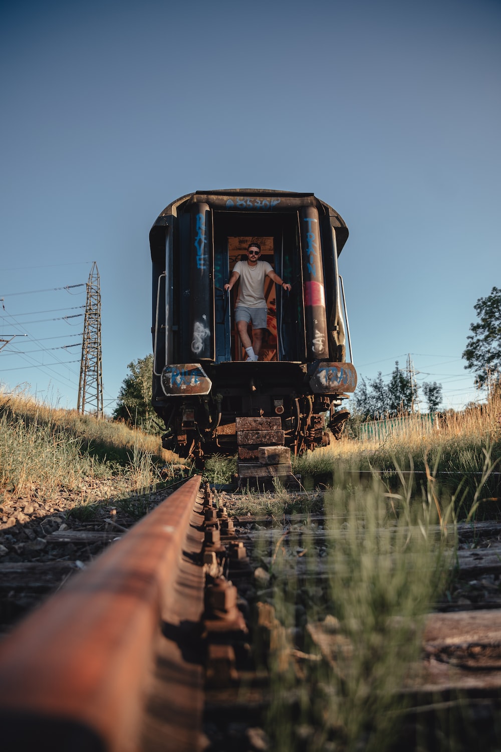 a person standing on the back of a train