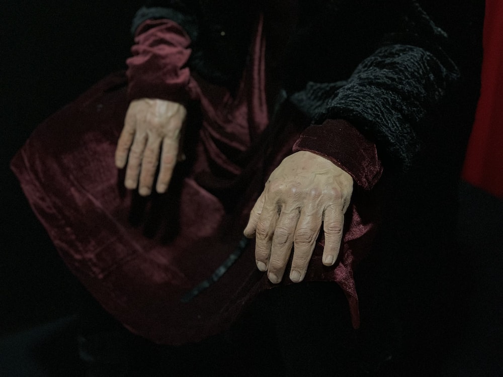 a person with their hands on a bag