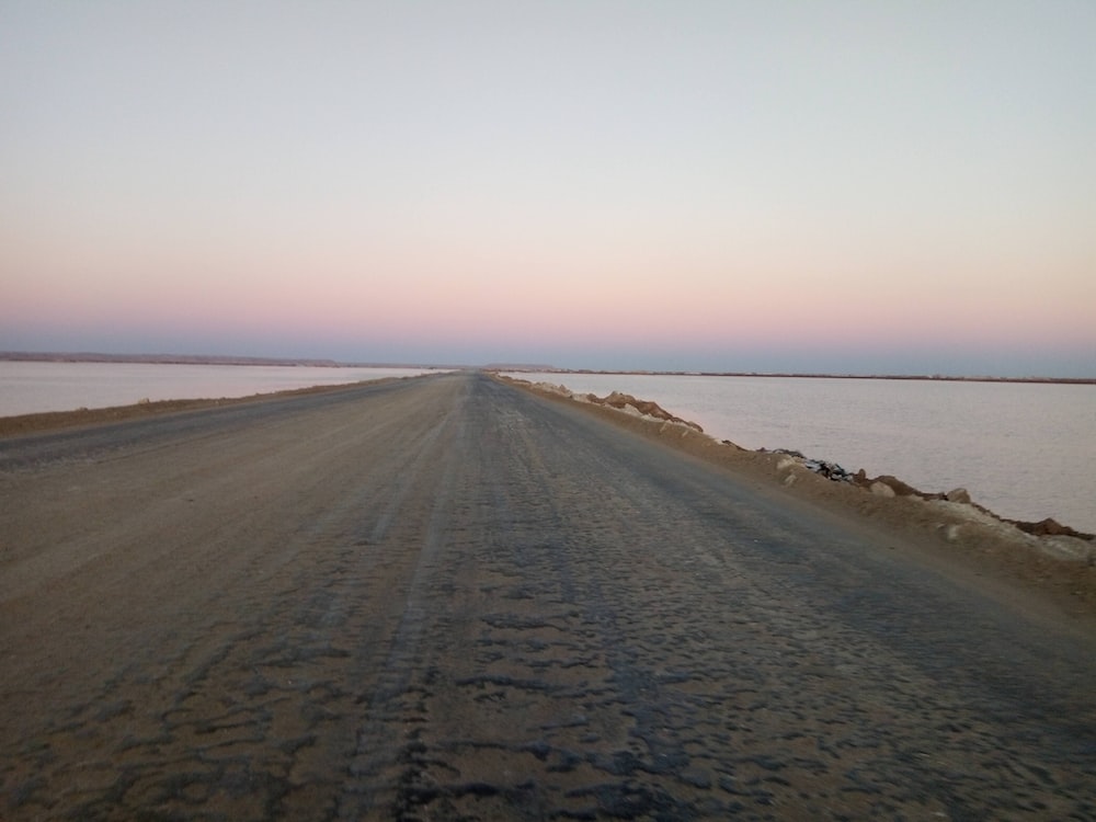 a road that is next to a body of water