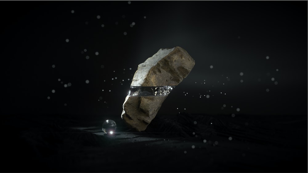 a rock with a ring on it in the dark