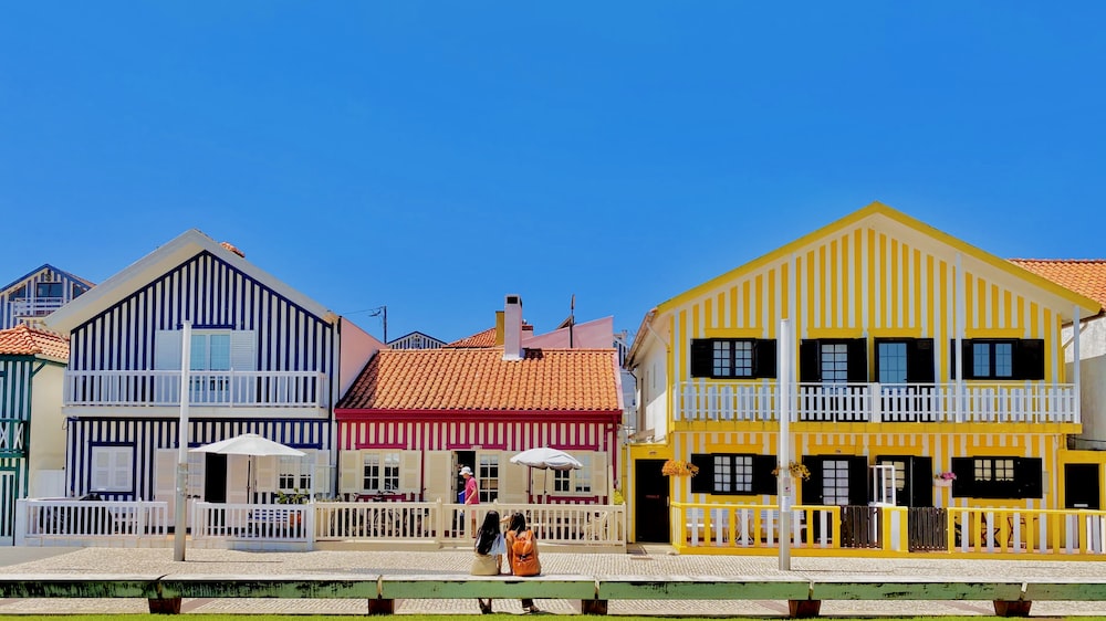 a row of colorful houses sitting next to each other