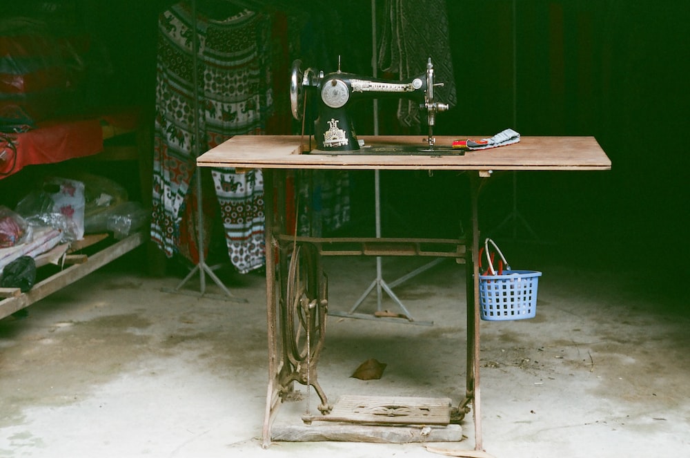 a sewing machine sitting on top of a wooden table