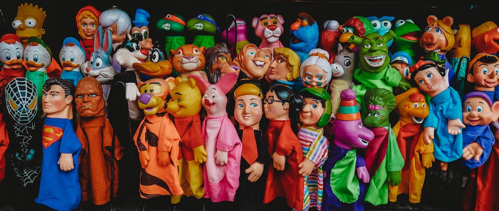 assorted Disney character toysd