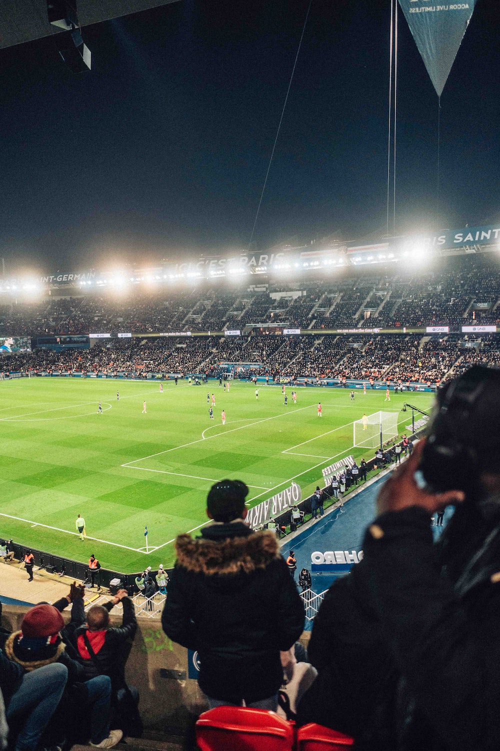 a stadium filled with people watching a soccer game