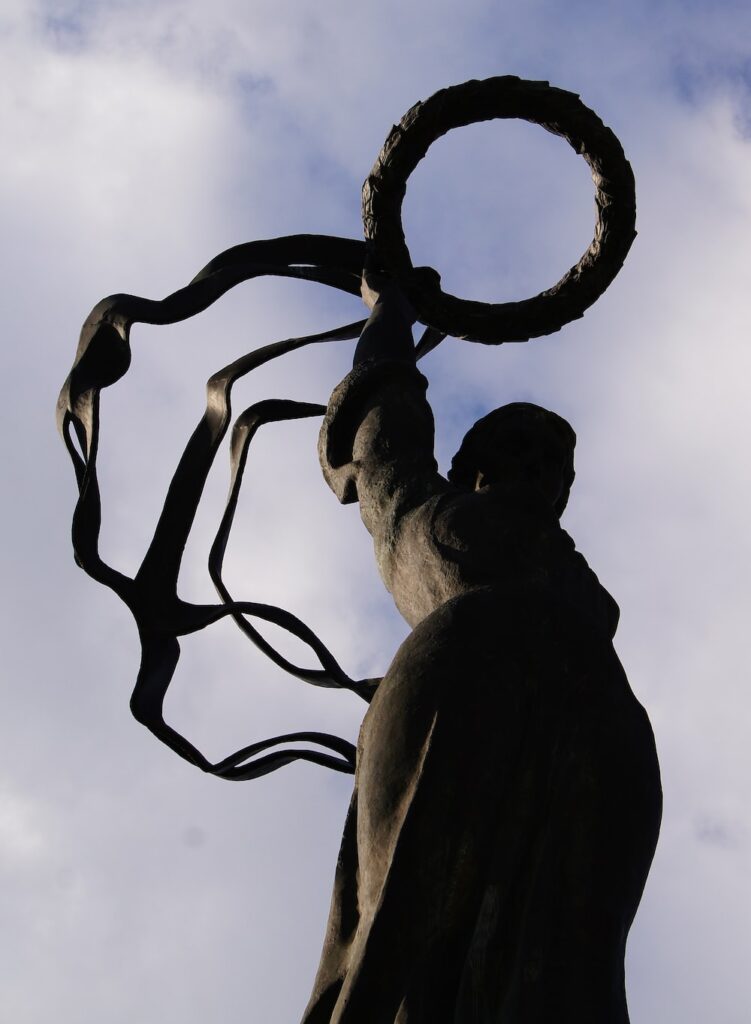 a statue of a man with a ring around his neck