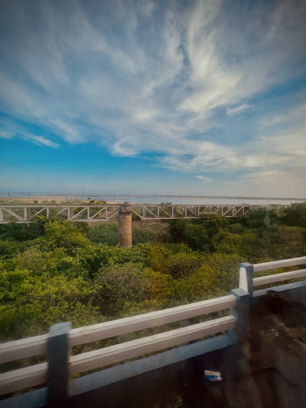 a view of a bridge from a moving vehicle