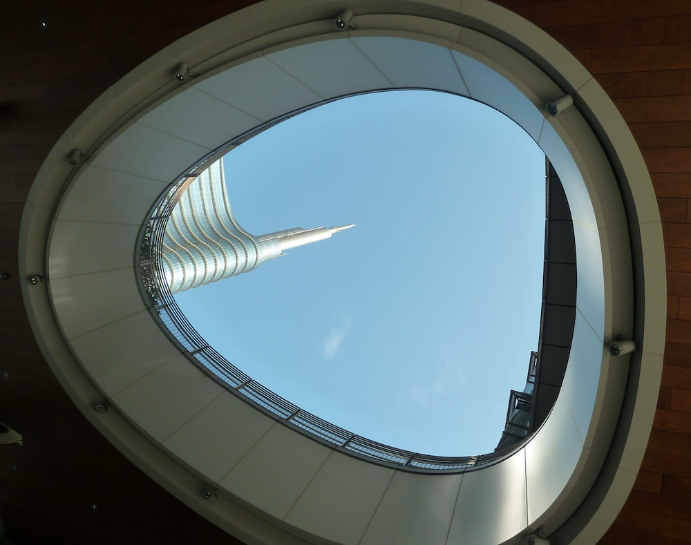 a view of a building through a circular window