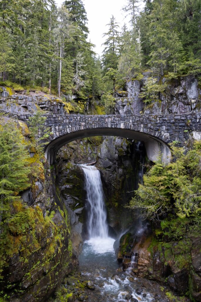 a waterfall over a bridge