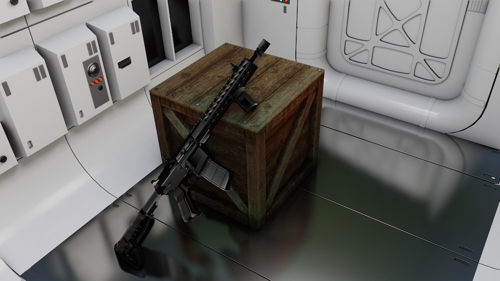 a wooden box with a rifle on top of it