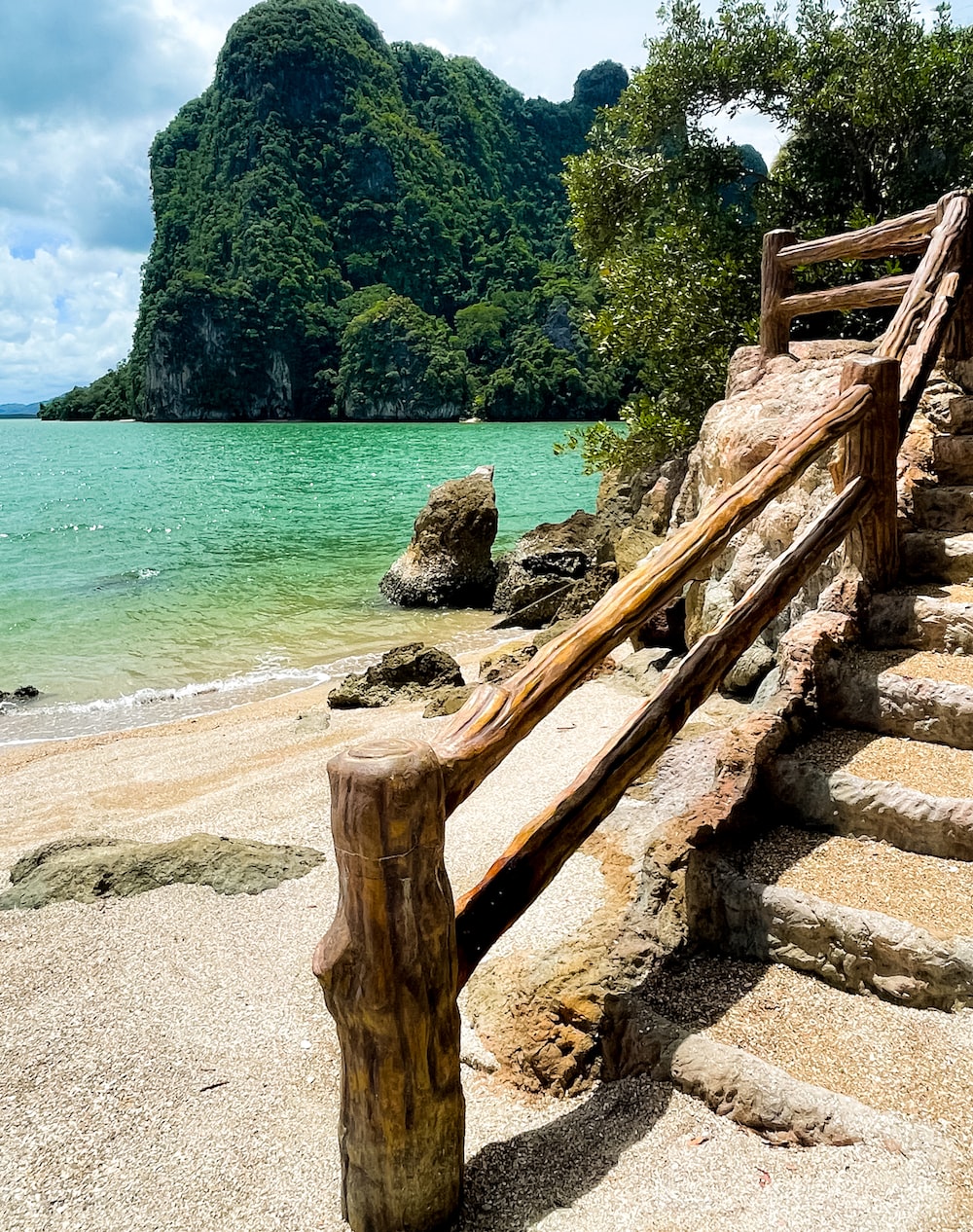 a wooden staircase leading to a beach