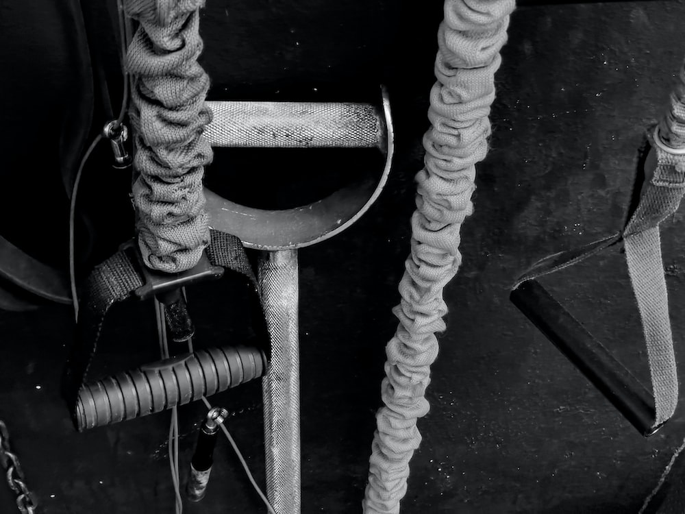 black and white rope on black metal bar