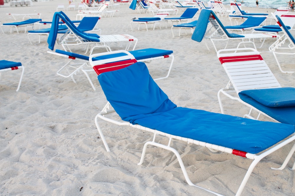 blue and white beach lounger with no people