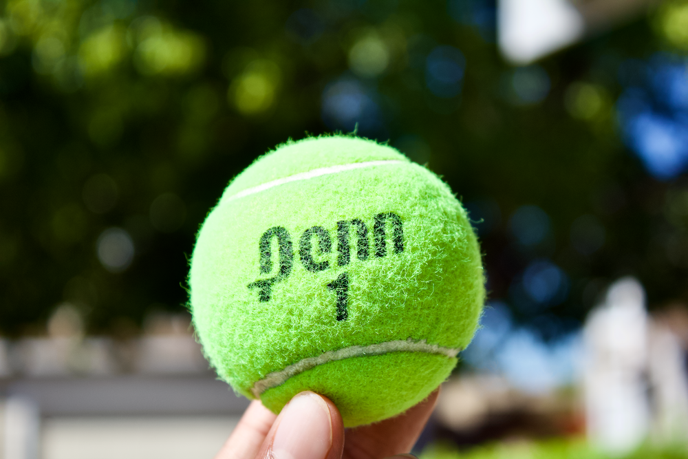 green tennis ball in close up photography