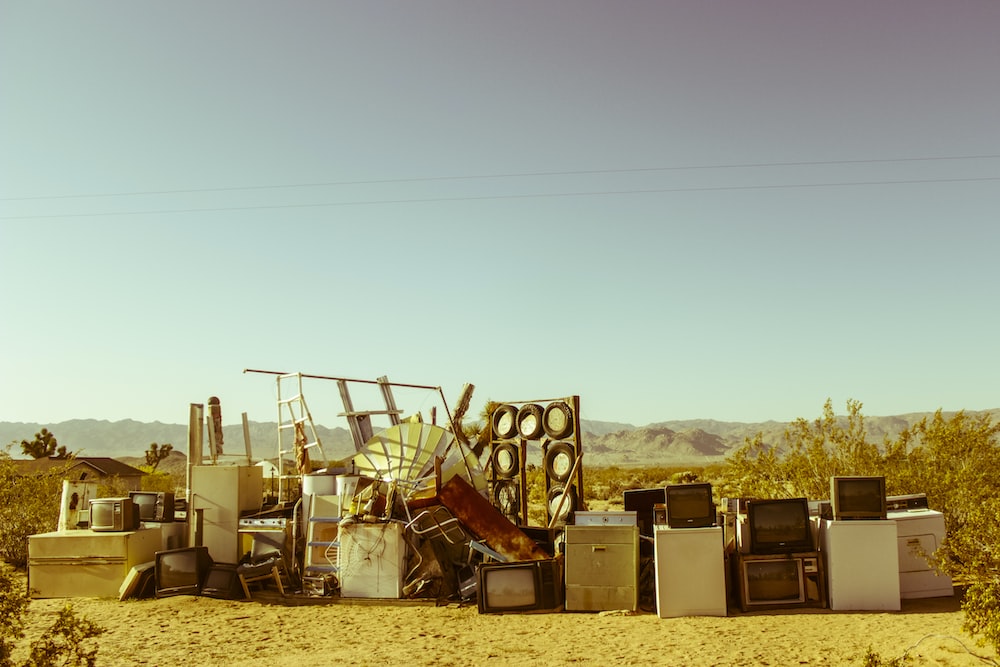 home appliance in the middle of the desert during daytime