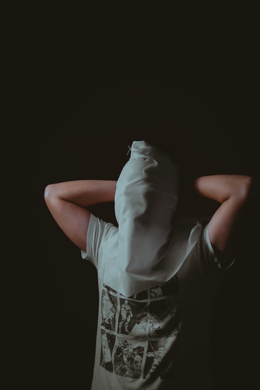 man covering face with cloth