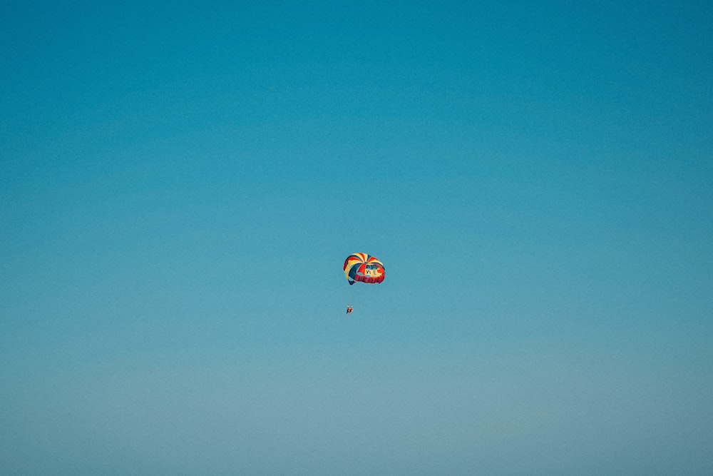 multicolored parachute in the sky during daytime