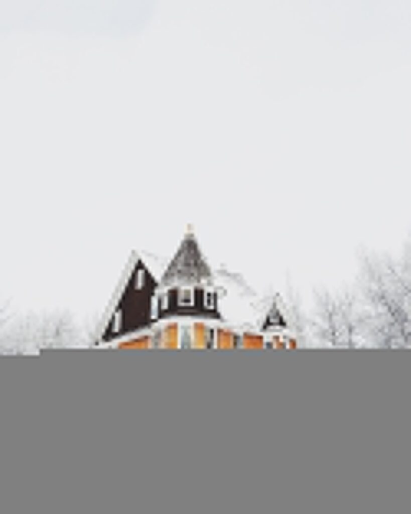 orange and gray concrete house surround by snow