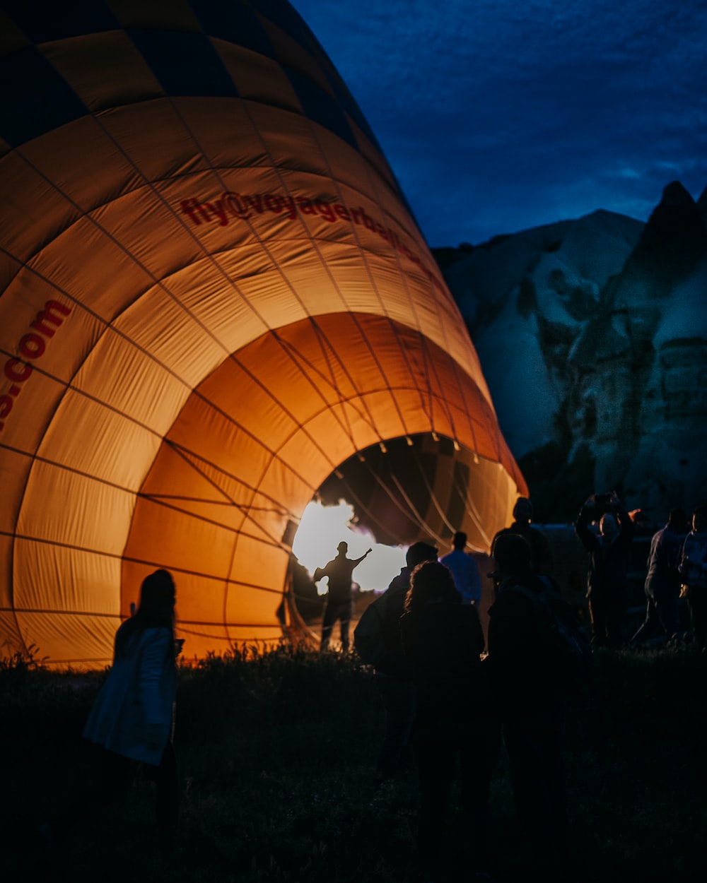 people standing on hot air balloon