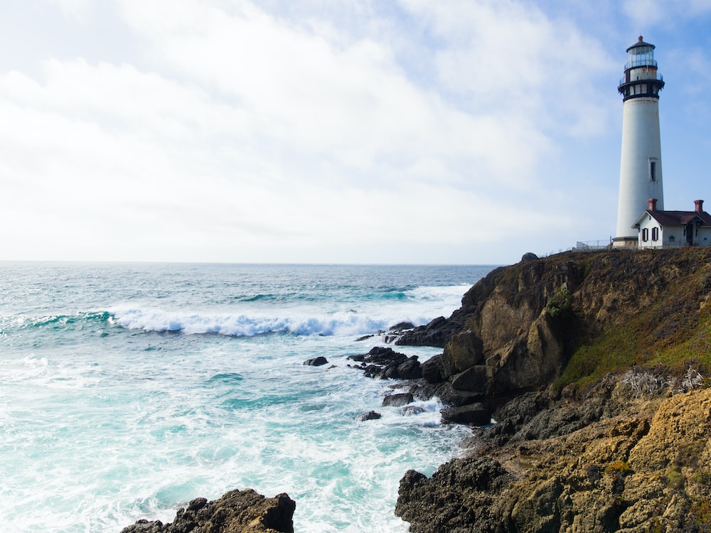 photo of lighthouse on cliff