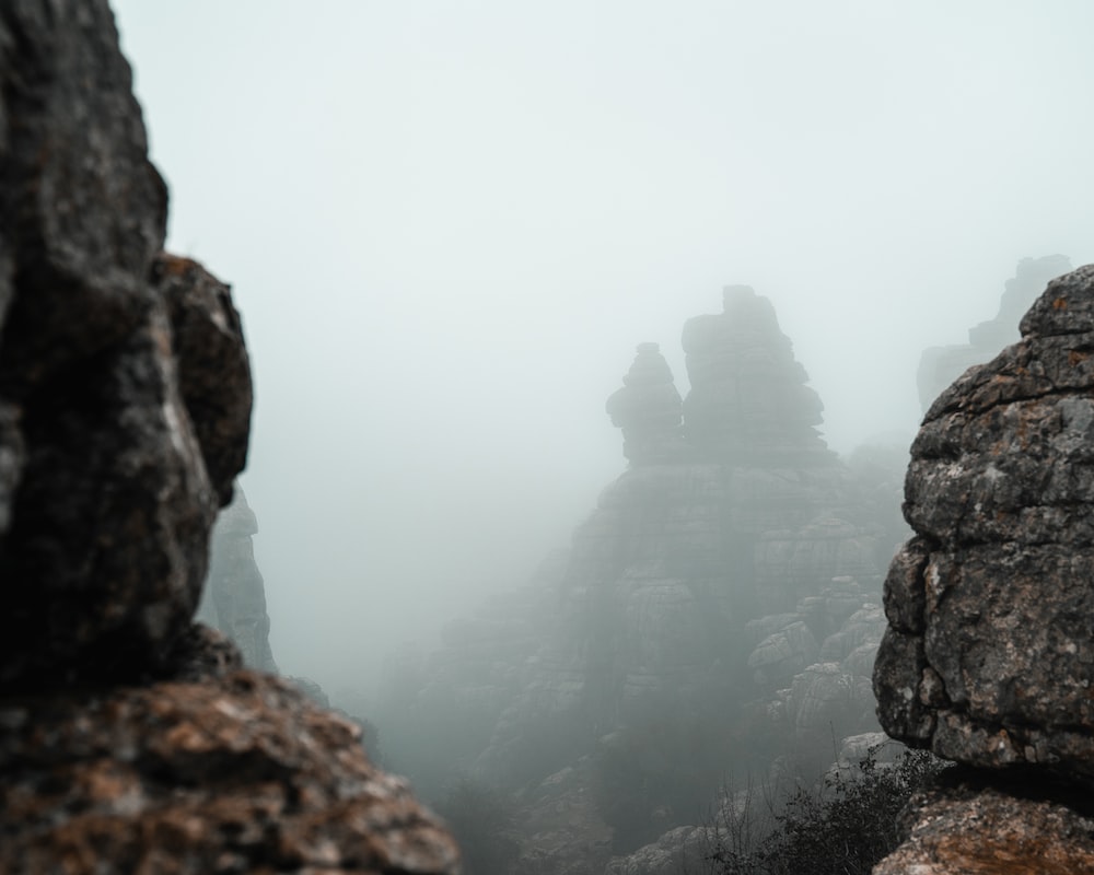 rocky mountain under foggy weather